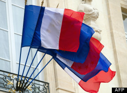 European and French flags wave in the wind at the Elysee presidential palace in Paris on June 4, 2012. AFP PHOTO / BERTRAND LANGLOIS