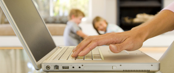 Hands of woman typing on laptop computer